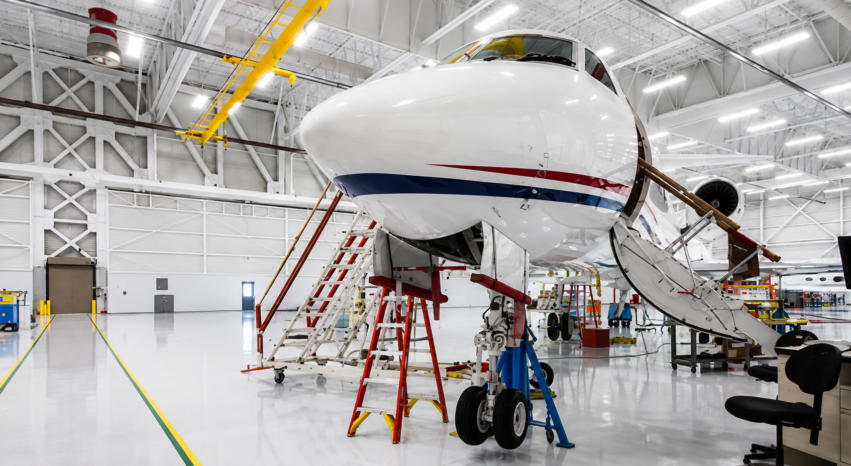 Aviation material handling and access equipment in an aircraft facility